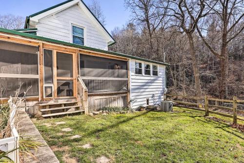 a white house with a fence next to a yard at Pet-Friendly Fries Home Less Than 6 Mi to New River! in Independence