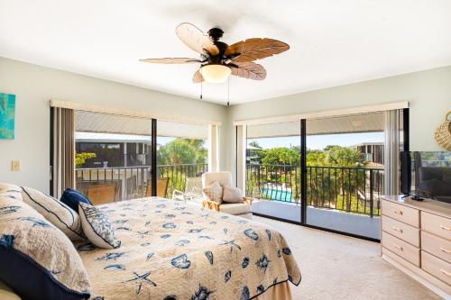 a bedroom with a bed and a ceiling fan at Gold Starfish in Marathon