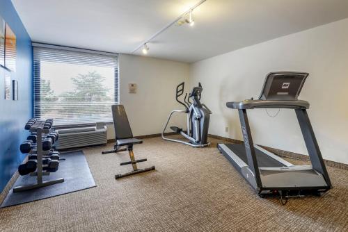 a gym with two tread machines and a treadmill at Comfort Inn Matthews / Charlotte in Matthews