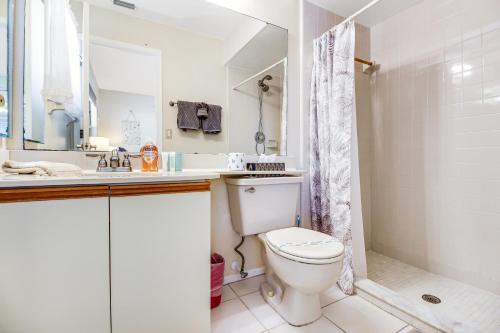 a bathroom with a toilet and a sink and a shower at Bella Villa in Bradenton