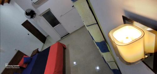 an overhead view of a bathroom with a light on the wall at Thanumi Polonnaruwa in Polonnaruwa