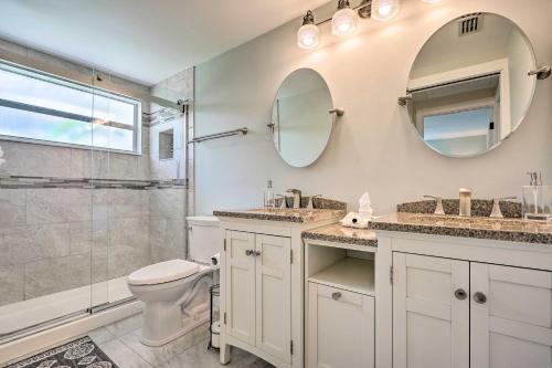 a bathroom with a sink and a toilet and a shower at Canalfront Punta Gorda Home with Private Dock! in Burnt Store Marina