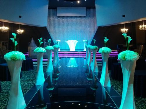 a group of blue vases with plants in them at Hyunjin Tourist Hotel in Donghae