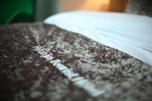a close up of the top of a brown book at Hyunjin Tourist Hotel in Donghae