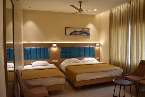 Postel nebo postele na pokoji v ubytování Hotel VPS Grand