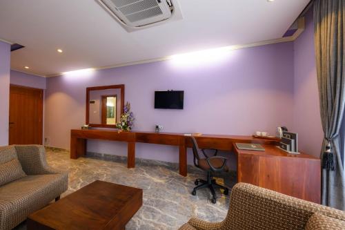 Телевизор и/или развлекательный центр в Boutique Villa Bougainvillea