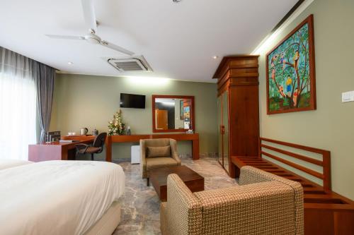 Телевизор и/или развлекательный центр в Boutique Villa Bougainvillea