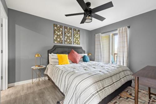 a bedroom with a bed and a ceiling fan at Lake Escape - Table Rock Lake in Branson