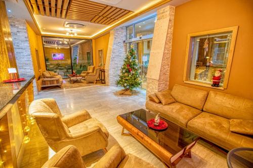 
a living room filled with furniture and a fire place at Hotel Nova Riviera in Ohrid
