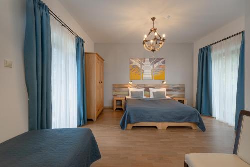 Кровать или кровати в номере Butikhotel Visegrád