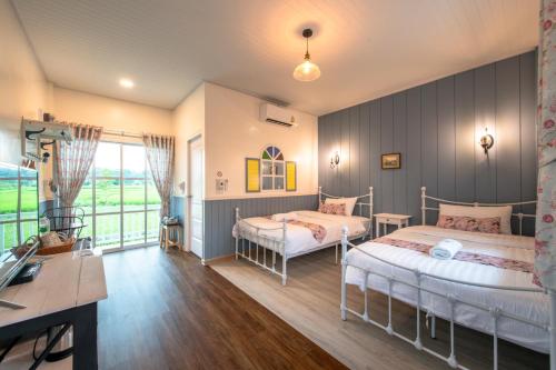 Postel nebo postele na pokoji v ubytování Baan Kang Hun Pua Cottage