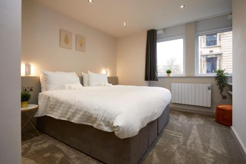 Katil atau katil-katil dalam bilik di Humber Lofts Apartments