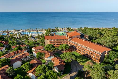 an aerial view of a resort with the ocean at Papillon Belvil Holiday Village in Belek