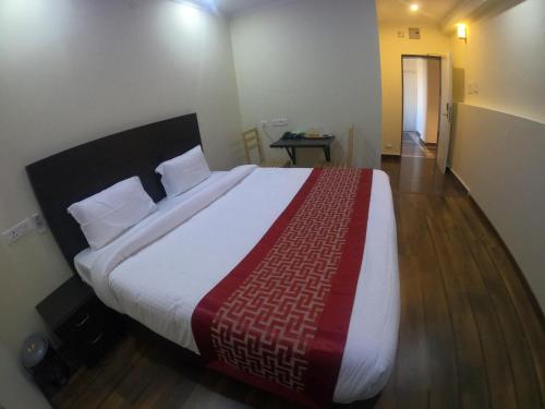 a bedroom with a large bed in a room at Venster Residency in Chennai