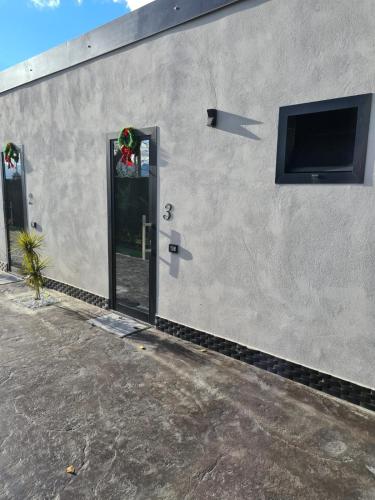 a building with a door with a television on it at B&B Villa Hermes in Sarno