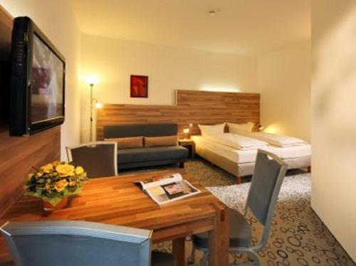 TV a/nebo společenská místnost v ubytování Petul Apart Hotel Am Ruhrbogen