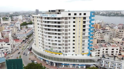 a tall white building with the words star hotel on it at City Centre in Mombasa