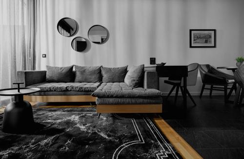 a living room with a couch and a table at No 15 Ermou Hotel in Thessaloniki