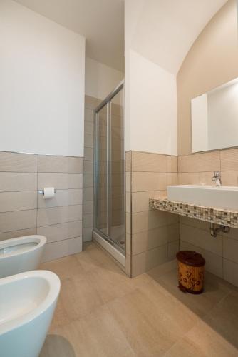 a bathroom with a toilet and a sink and a shower at B&B Belvedere in Agropoli