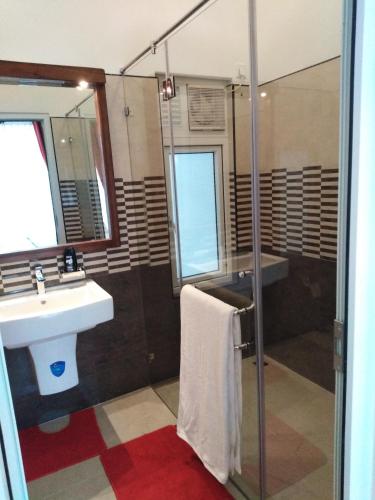 a bathroom with a sink and a shower at Y&Y Residence in Kandy