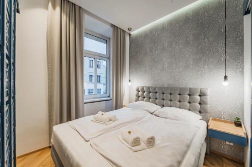 Posteľ alebo postele v izbe v ubytovaní ZEUS Design Apartments - Reumannplatz