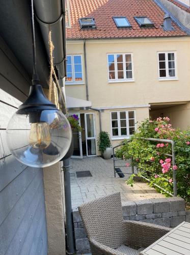 a light hanging from the side of a house at Hotel Aarhus City Apartments in Aarhus