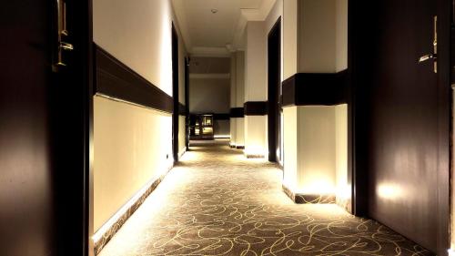 a hallway with lights on the walls of a building at Mokinba Hotels Montebianco in Milan