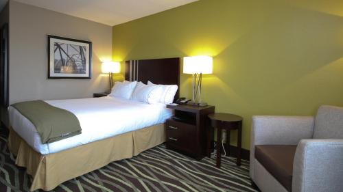 a hotel room with two beds and a lamp at Holiday Inn Express Marshall, an IHG Hotel in Marshall