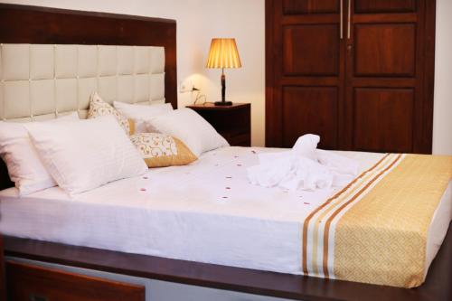 Кровать или кровати в номере Triple Edge Villa
