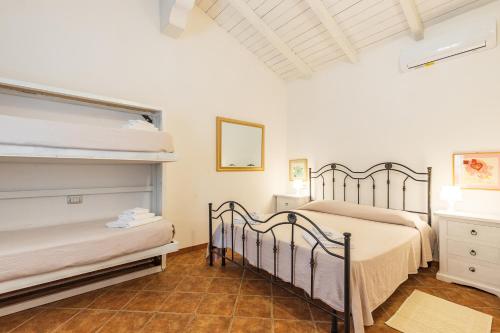 Cama o camas de una habitación en Albergo Residenziale Menhirs
