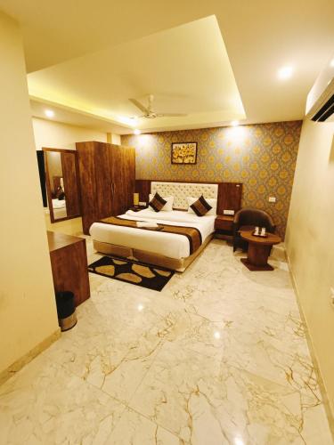 a hotel room with a bed and a desk at Mayda Inn- A Boutique Hotel in New Delhi