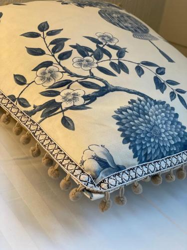 a blue and white cake with flowers on it at Hotell Hamngatan 27 in Falkenberg