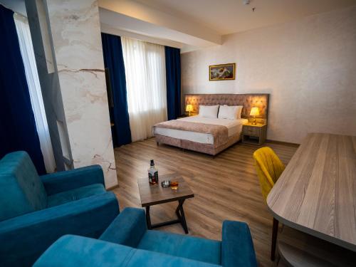 Ένα ή περισσότερα κρεβάτια σε δωμάτιο στο La Corne Hotel Baku