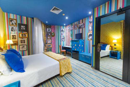 Postel nebo postele na pokoji v ubytování Admiral Art Hotel