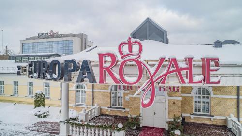 a large sign for a hotel in the snow at Europa Royale Druskininkai in Druskininkai