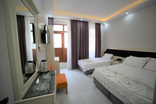 a hotel room with a bed and a couch at taksim diamond hotel in Istanbul