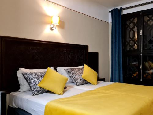 Postel nebo postele na pokoji v ubytování Hotel Batha