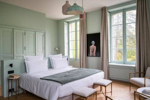 מיטה או מיטות בחדר ב-Le Domaine de Primard