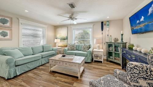 a living room with a couch and a table at Canal Upper-Gorgeous 3 bed 3 bath near SK Village in Siesta Key