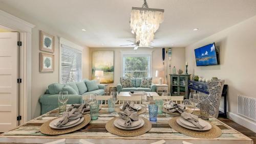 a living room with a table with hats on it at Canal Upper-Gorgeous 3 bed 3 bath near SK Village in Siesta Key