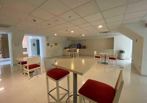 a large room with a table and chairs in it at Hotel MX forum buenavista CDMX, Trademark by Wyndham in Mexico City