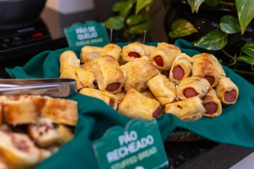 a bunch of hot dogs in buns on a table at Ecco Hotel Fortaleza in Fortaleza
