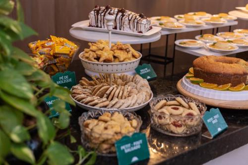 a display of desserts and pastries on a table at Ecco Hotel Fortaleza in Fortaleza