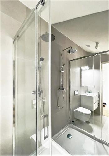 a bathroom with a shower and a toilet and a sink at Hey Studio - Free Parking and Smart TV in Aveiro