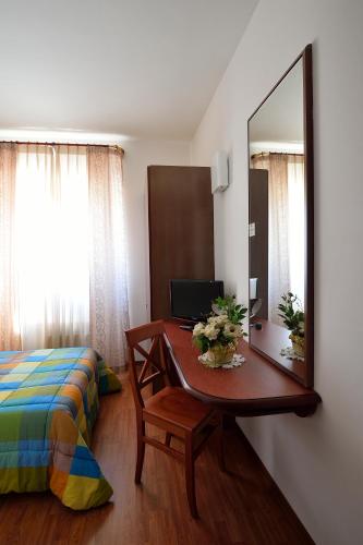 Letto o letti in una camera di Hotel Italia