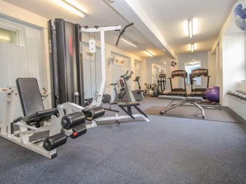 a gym with several exercise equipment in a room at 60 Valley Lodge in Callington