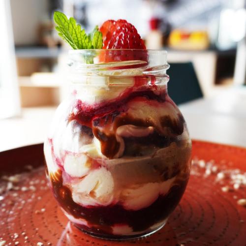 a jar of ice cream with a strawberry in it at ibis Chia in Chía