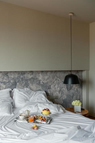 Un ou plusieurs lits dans un hébergement de l'établissement Hotel Leopardi