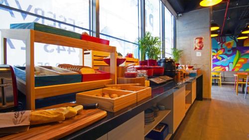 a bakery with a counter with some bread on it at ibis budget Bogota Marly in Bogotá