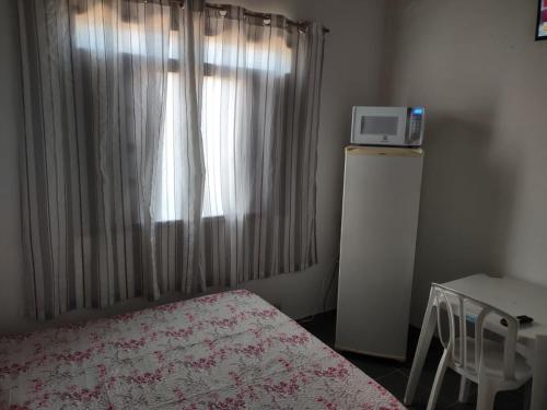 Una cama o camas en una habitación de Pousada Familiar Morada do Rapha